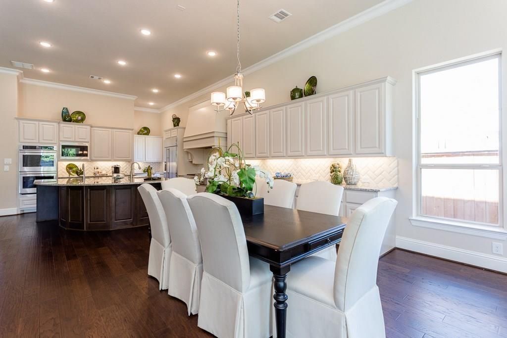 Chandelier, Dining room, Interior, Kitchen, Recessed Lighting, Stainless Steel Appliances, Wood Texture Flooring