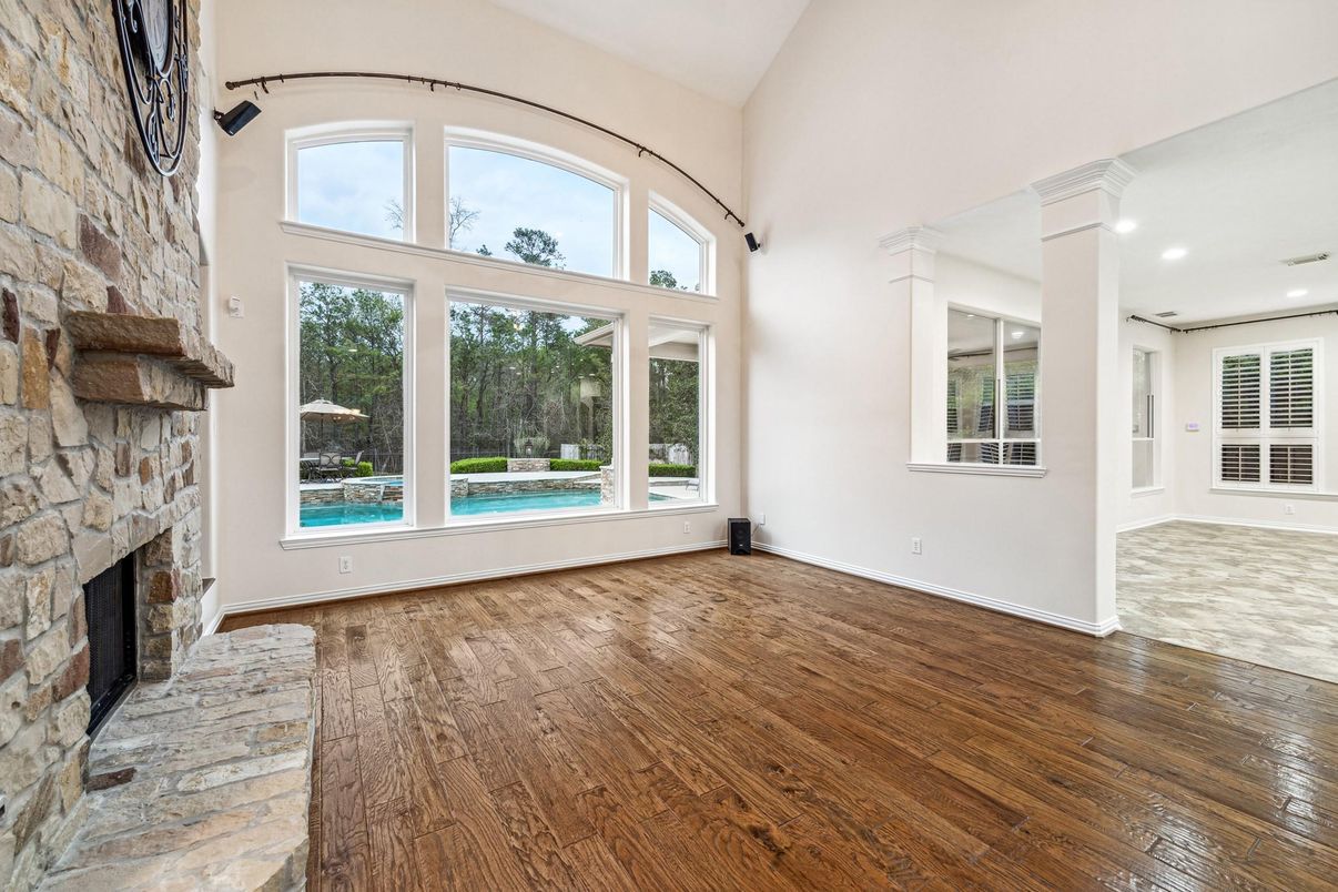 Empty room, Fireplace, Interior, Recessed Lighting, Stone Walls, Wood Texture Flooring