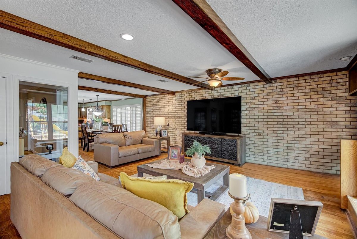 Dining room, Fireplace, Interior, Living room, Recessed Lighting, Stone Walls, Wood Texture Flooring