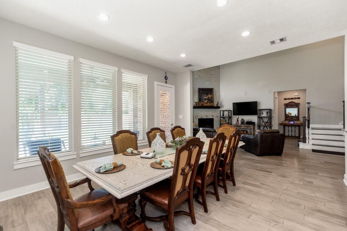 Dining room, Fireplace, Interior, Living room, Recessed Lighting, Wood Texture Flooring