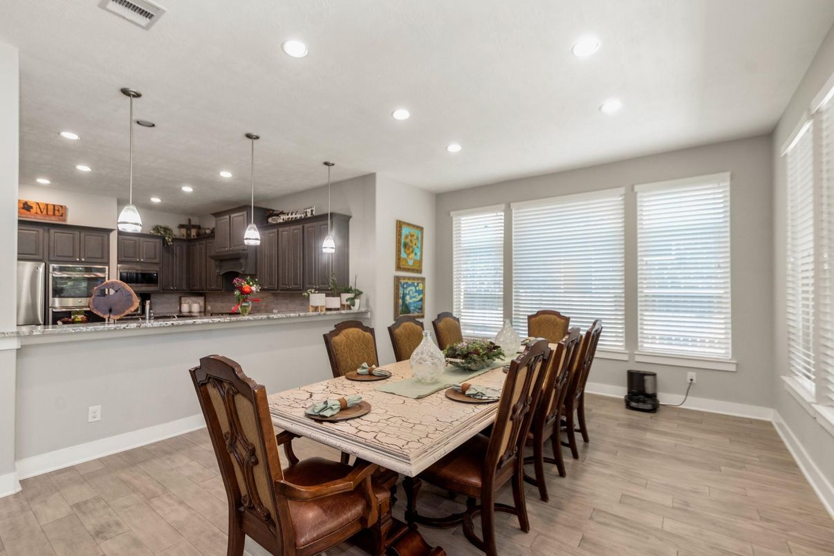 Dining room, Interior, Kitchen, Pendant Lights, Recessed Lighting, Stainless Steel Appliances, Wood Texture Flooring