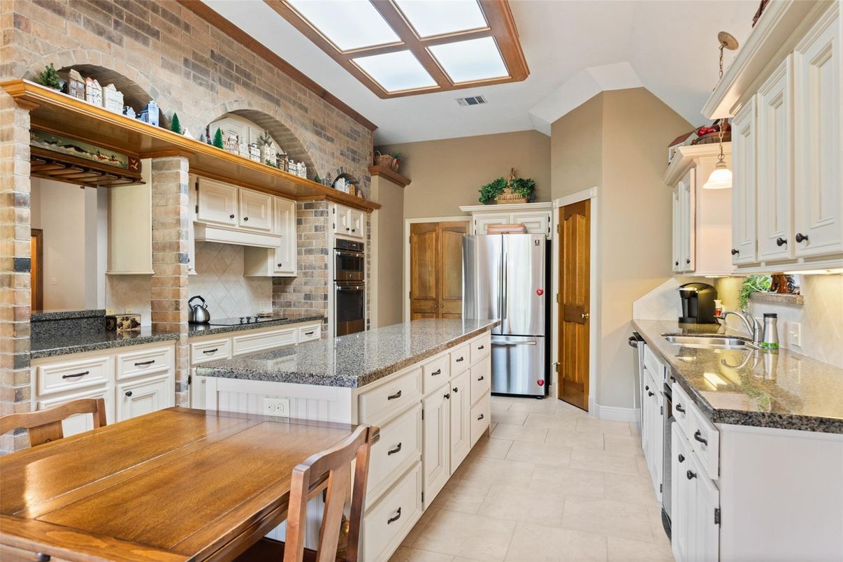 Interior, Kitchen, Pendant Lights, Stainless Steel Appliances, Stone Walls