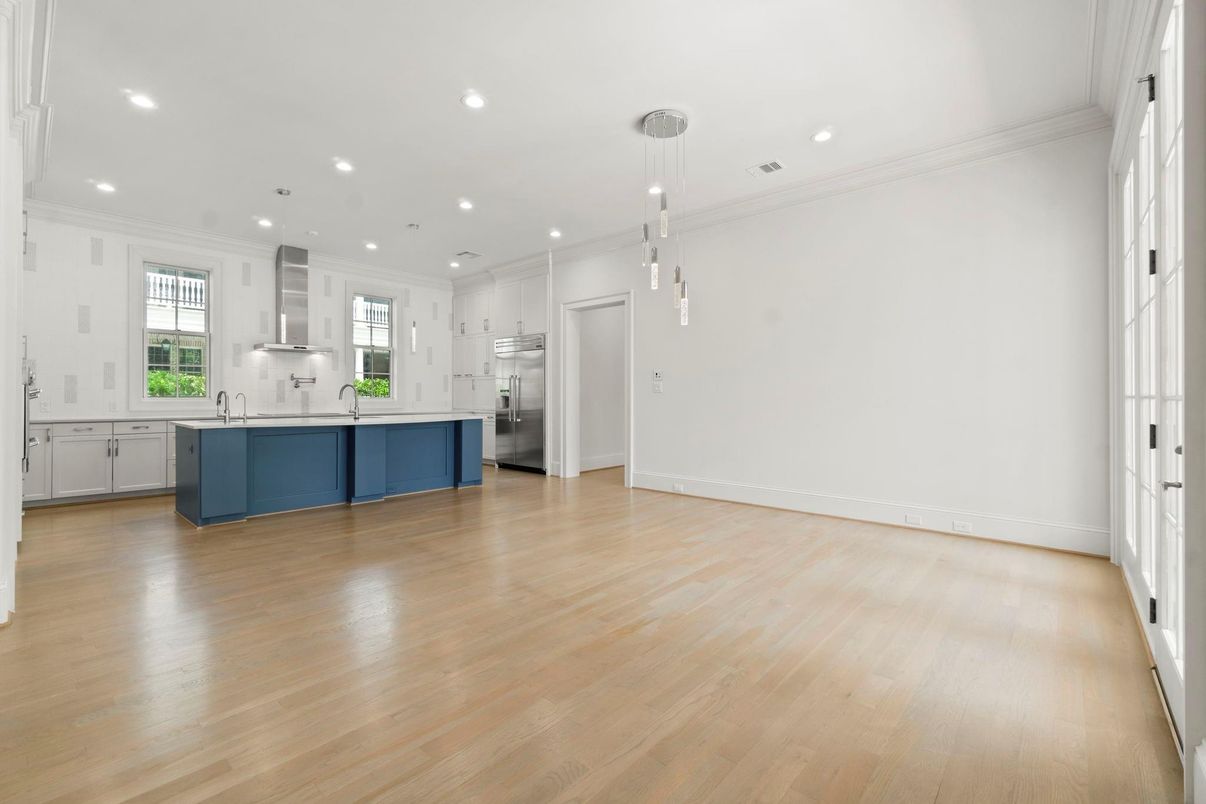 Empty room, Interior, Kitchen, Pendant Lights, Recessed Lighting, Stainless Steel Appliances, Wood Texture Flooring