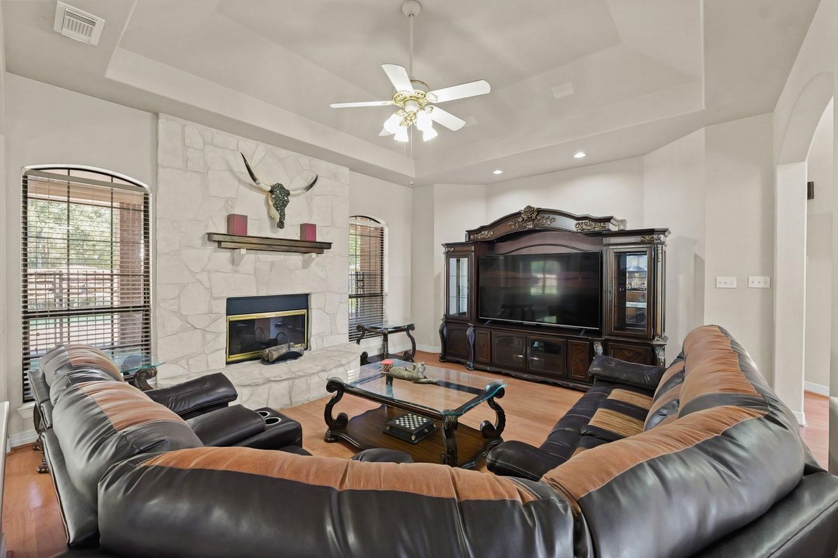 Fireplace, Interior, Living room, Recessed Lighting, Stone Walls, Wood Texture Flooring