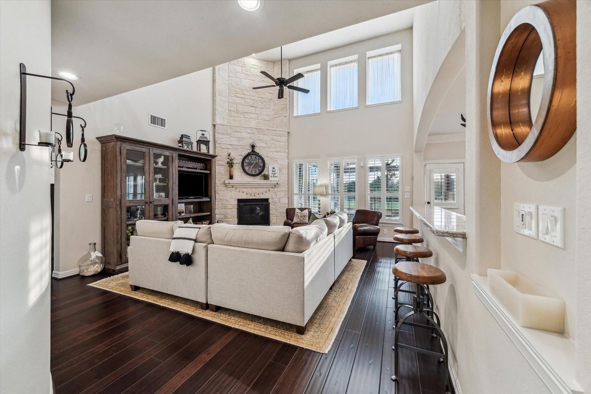 Fireplace, Interior, Living room, Recessed Lighting, Stone Walls, Wood Texture Flooring