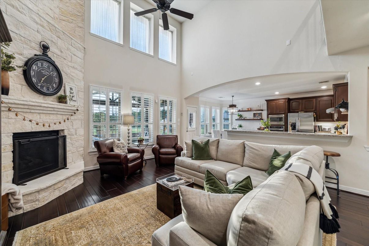 Fireplace, Interior, Kitchen, Living room, Recessed Lighting, Stainless Steel Appliances, Stone Walls, Wood Texture Flooring