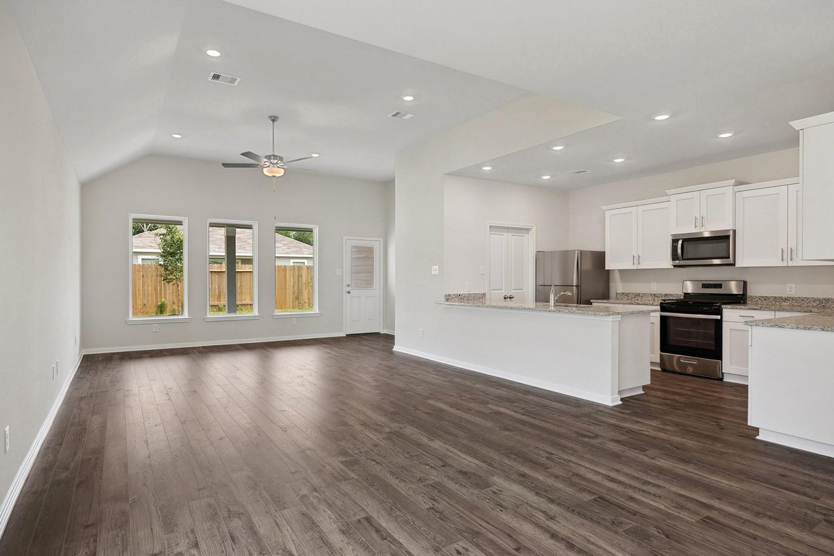 Empty room, Interior, Kitchen, Recessed Lighting, Stainless Steel Appliances, Wood Texture Flooring