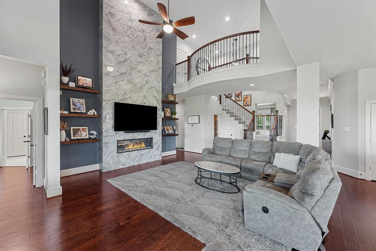 Fireplace, Interior, Living room, Marble Walls, Recessed Lighting, Wood Texture Flooring