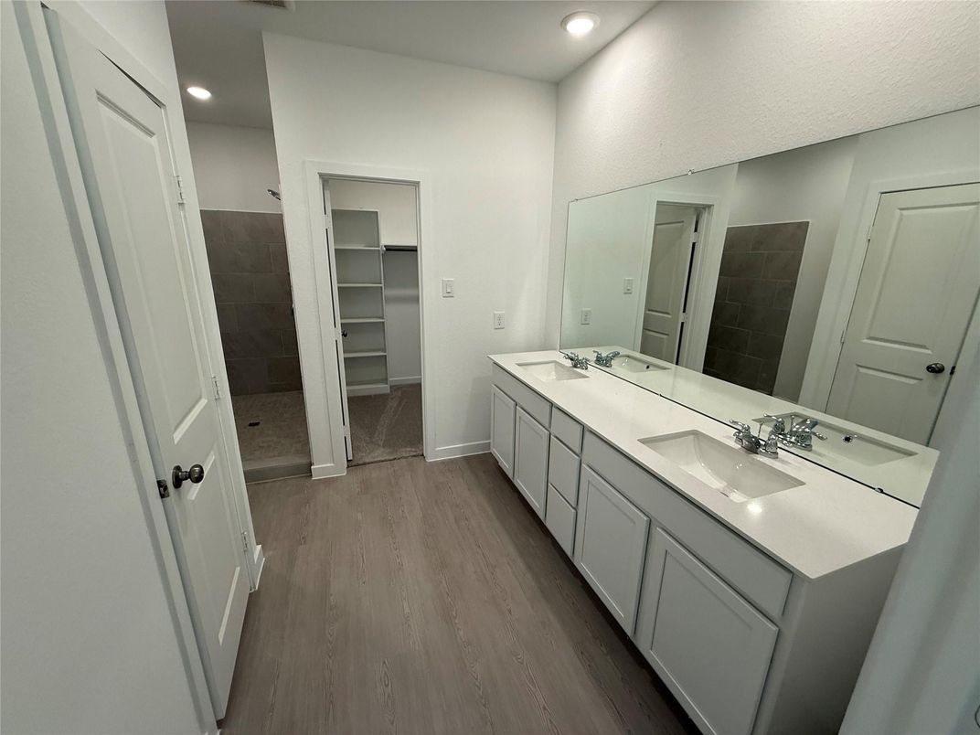 Bathroom, Dual Sink Vanities, Interior, Recessed Lighting, Walk-in Closets, Wood Texture Flooring