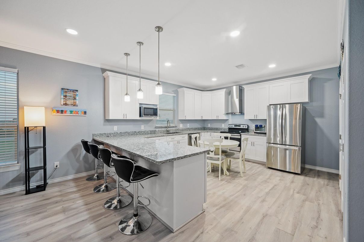 Dining room, Interior, Kitchen, Pendant Lights, Recessed Lighting, Stainless Steel Appliances, Wood Texture Flooring