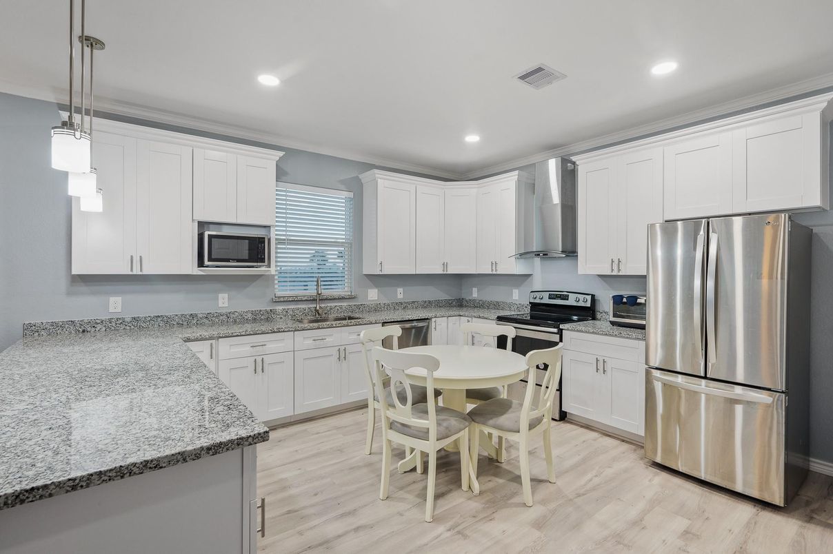 Dining room, Interior, Kitchen, Pendant Lights, Recessed Lighting, Stainless Steel Appliances, Wood Texture Flooring