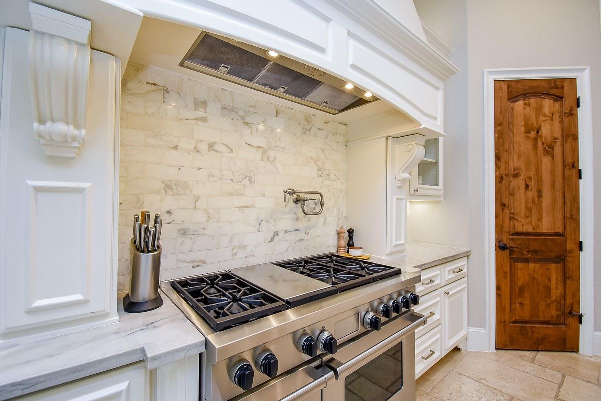 Interior, Kitchen, Marble Walls, Recessed Lighting, Stainless Steel Appliances