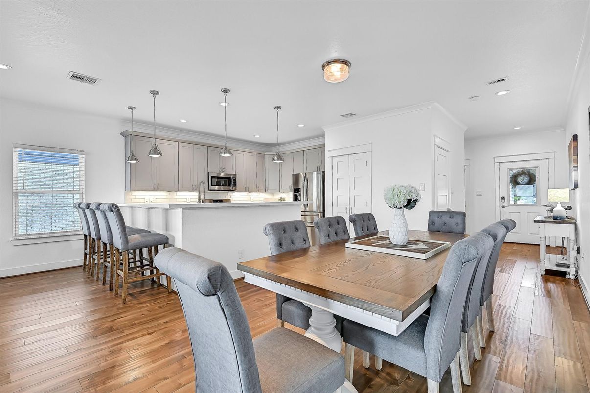 Dining room, Interior, Kitchen, Pendant Lights, Recessed Lighting, Stainless Steel Appliances, Wood Texture Flooring