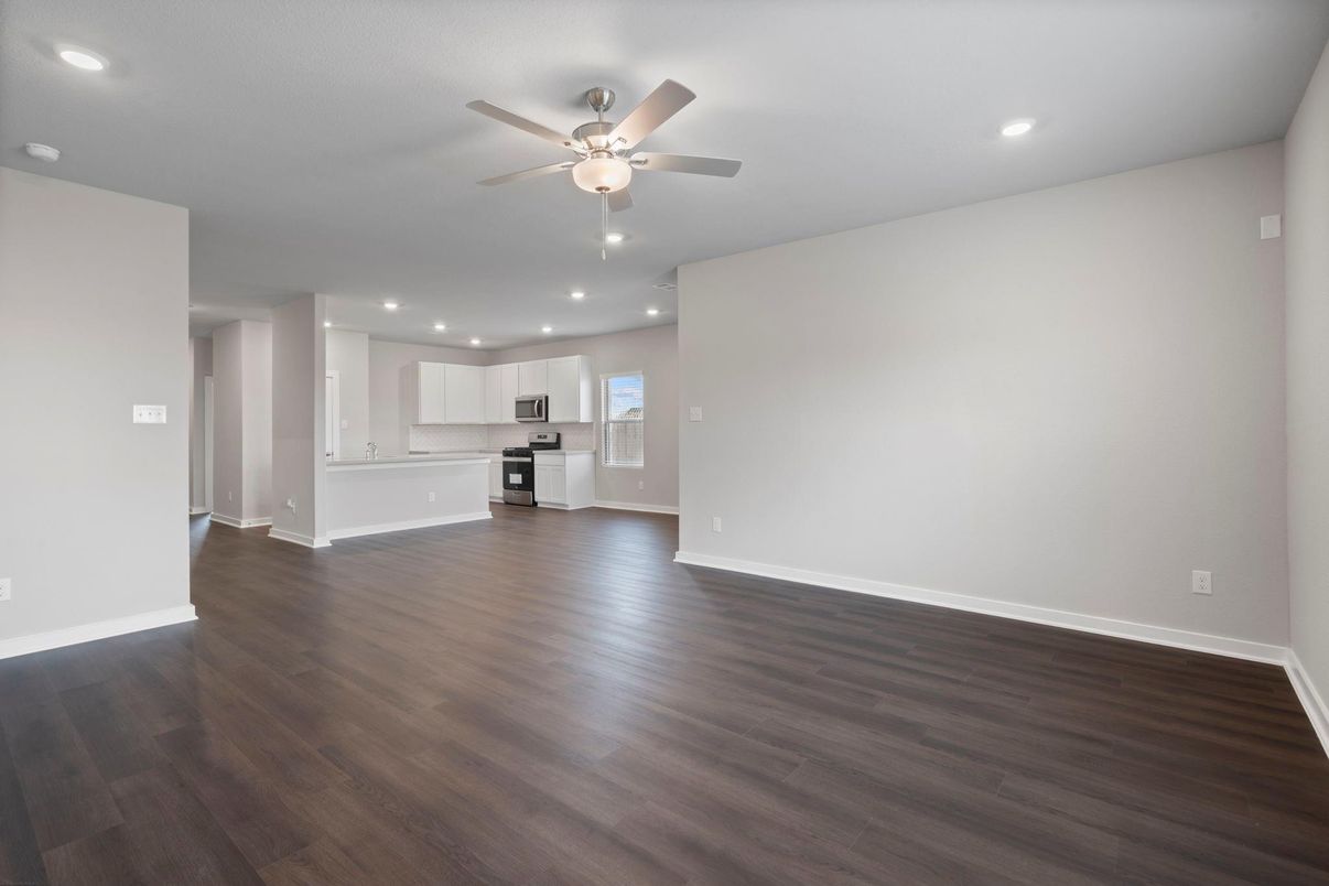 Empty room, Interior, Kitchen, Recessed Lighting, Stainless Steel Appliances, Wood Texture Flooring