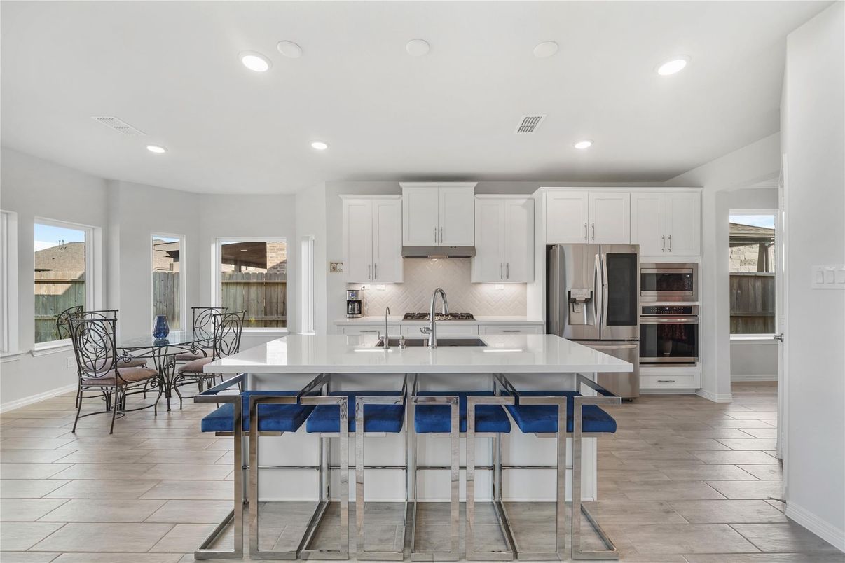 Dining room, Interior, Kitchen, Recessed Lighting, Stainless Steel Appliances, Wood Texture Flooring