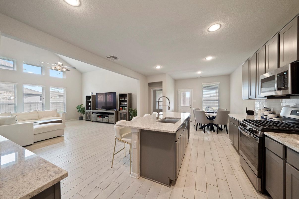 Dining room, Interior, Kitchen, Living room, Recessed Lighting, Stainless Steel Appliances, Wood Texture Flooring