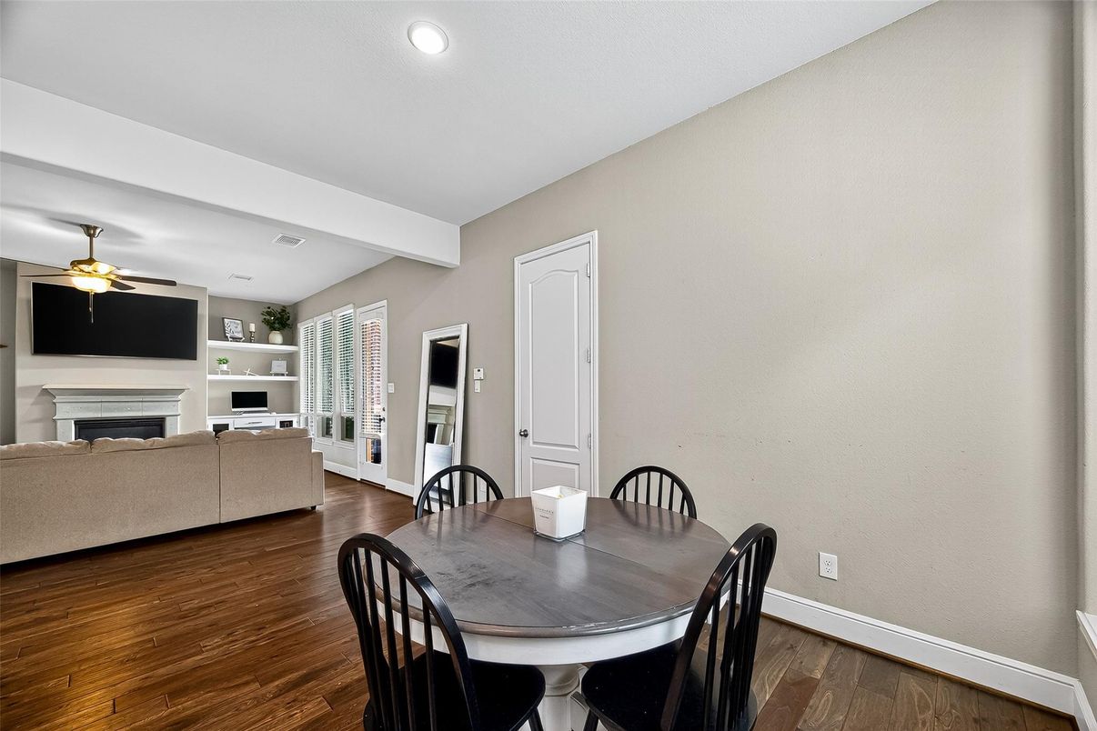 Dining room, Fireplace, Interior, Living room, Recessed Lighting, Wood Texture Flooring