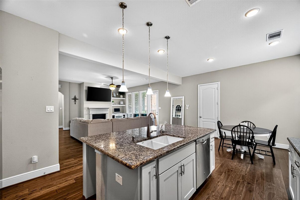 Dining room, Fireplace, Interior, Kitchen, Pendant Lights, Recessed Lighting, Wood Texture Flooring