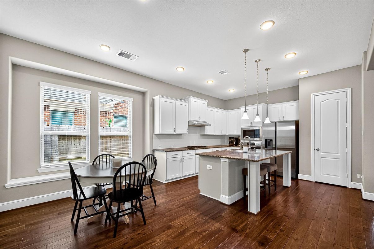 Dining room, Interior, Kitchen, Pendant Lights, Recessed Lighting, Stainless Steel Appliances, Wood Texture Flooring