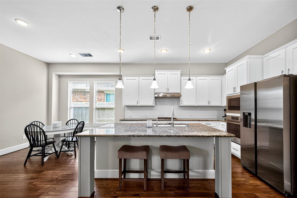 Dining room, Interior, Kitchen, Pendant Lights, Recessed Lighting, Stainless Steel Appliances, Wood Texture Flooring