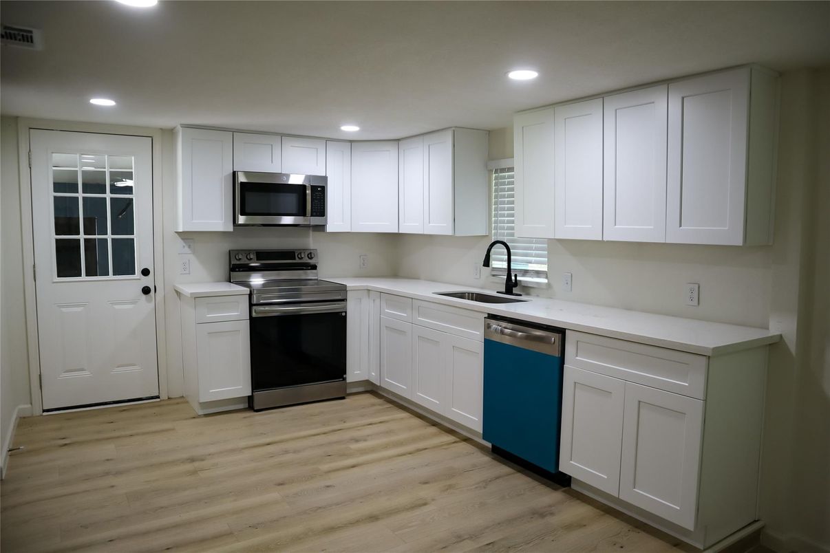 Interior, Kitchen, Recessed Lighting, Stainless Steel Appliances, Wood Texture Flooring