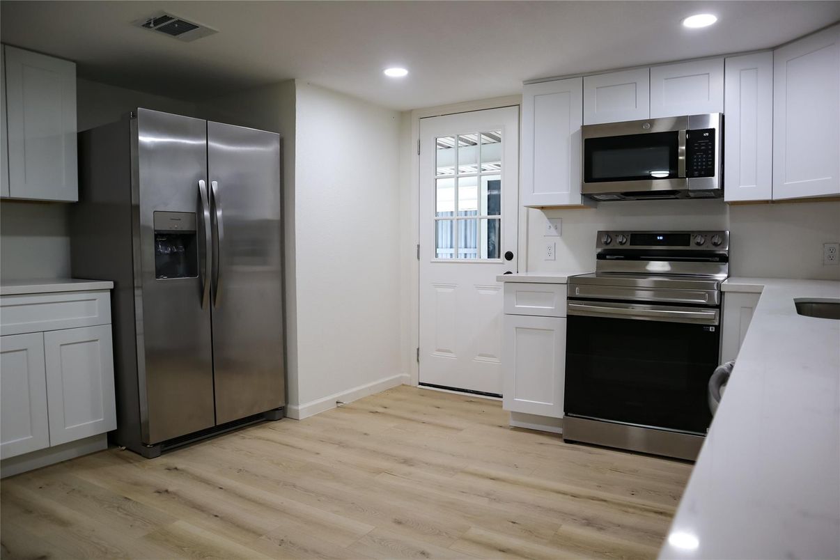 Interior, Kitchen, Recessed Lighting, Stainless Steel Appliances, Wood Texture Flooring