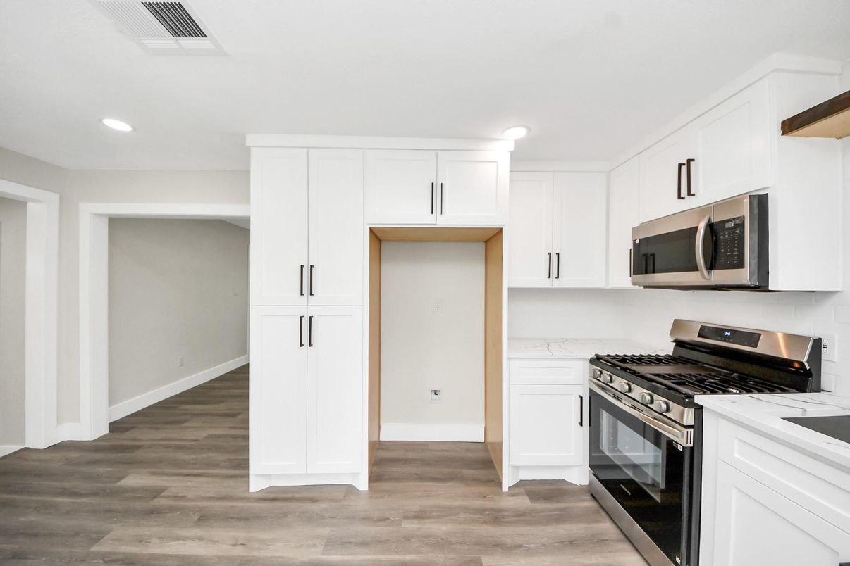 Interior, Kitchen, Recessed Lighting, Stainless Steel Appliances, Wood Texture Flooring