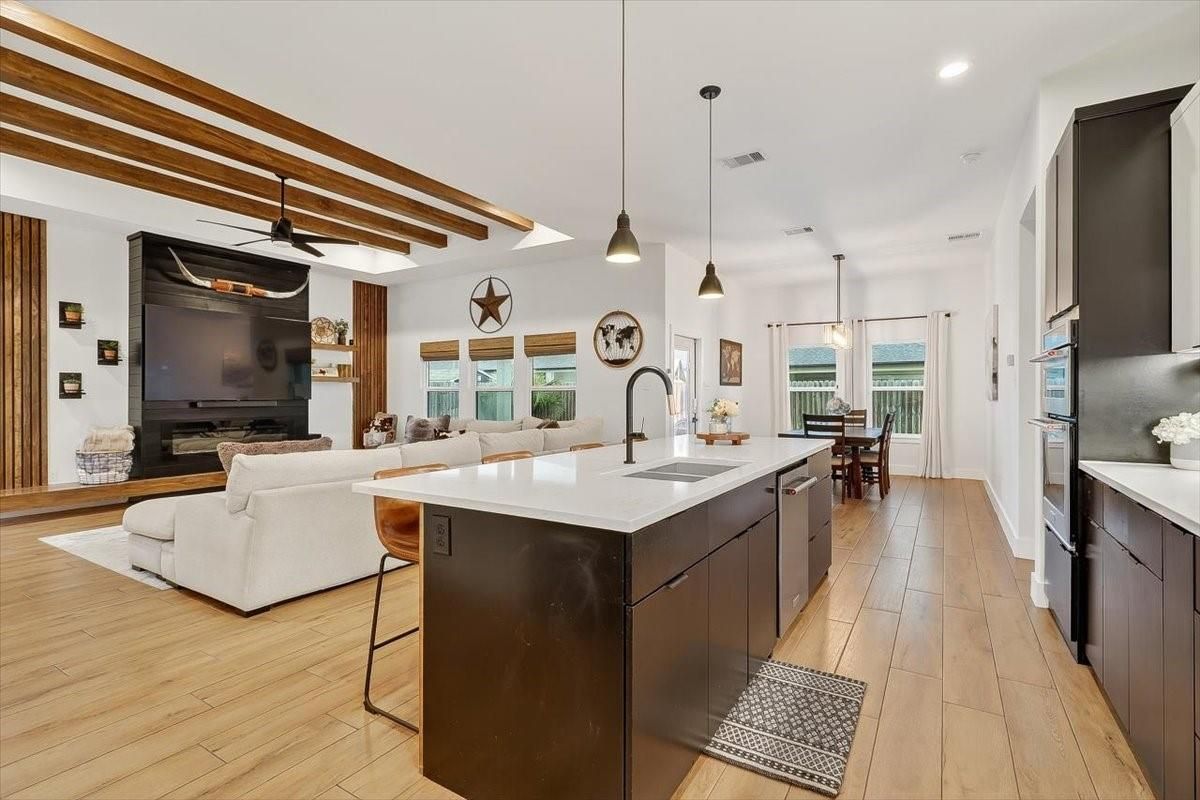 Dining room, Fireplace, Interior, Kitchen, Living room, Pendant Lights, Recessed Lighting, Wooden Beams, Wood Texture Flooring