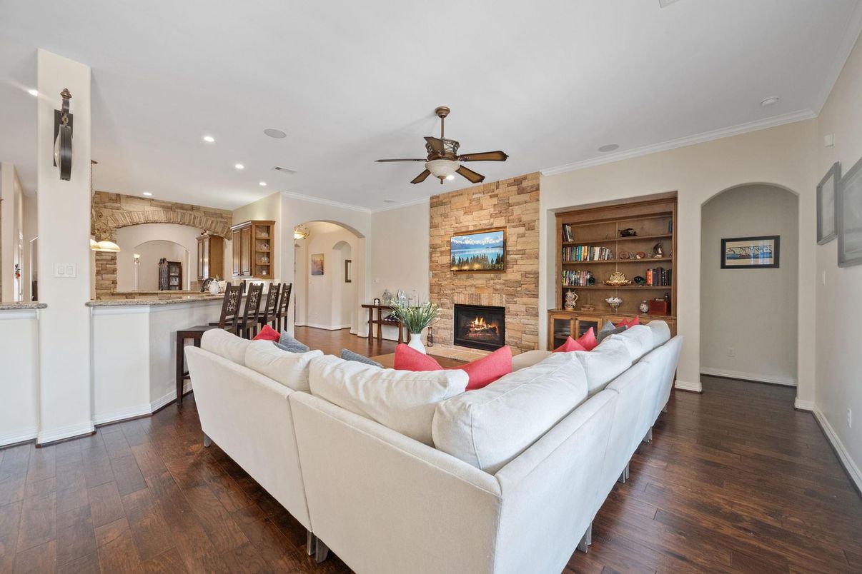 Fireplace, Interior, Living room, Recessed Lighting, Stone Walls, Wood Texture Flooring