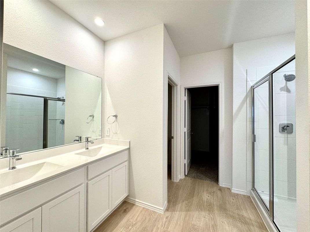 Bathroom, Dual Sink Vanities, Glass Shower, Interior, Recessed Lighting, Wood Texture Flooring
