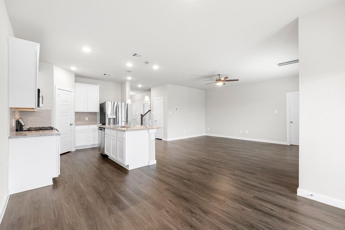 Empty room, Interior, Kitchen, Pendant Lights, Recessed Lighting, Stainless Steel Appliances, Wood Texture Flooring