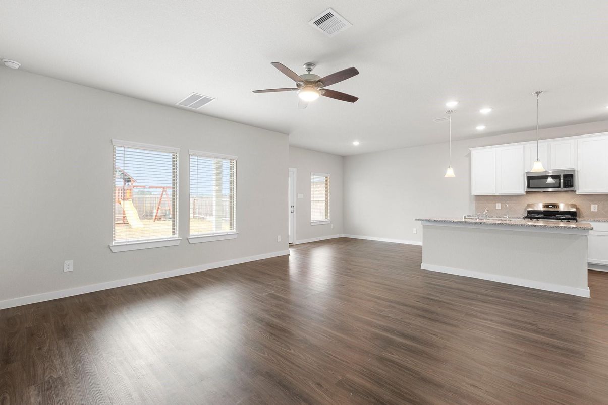 Empty room, Interior, Kitchen, Pendant Lights, Recessed Lighting, Stainless Steel Appliances, Wood Texture Flooring