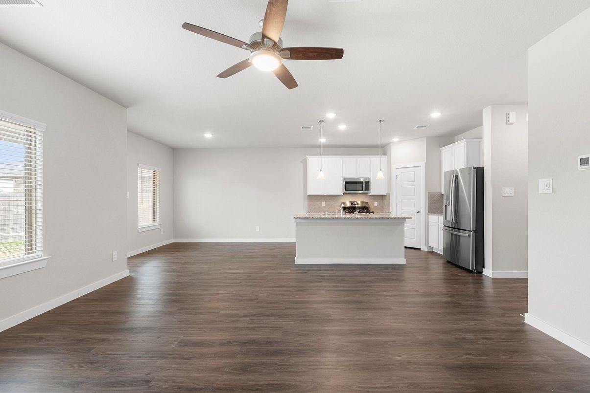 Empty room, Interior, Kitchen, Pendant Lights, Recessed Lighting, Stainless Steel Appliances, Wood Texture Flooring