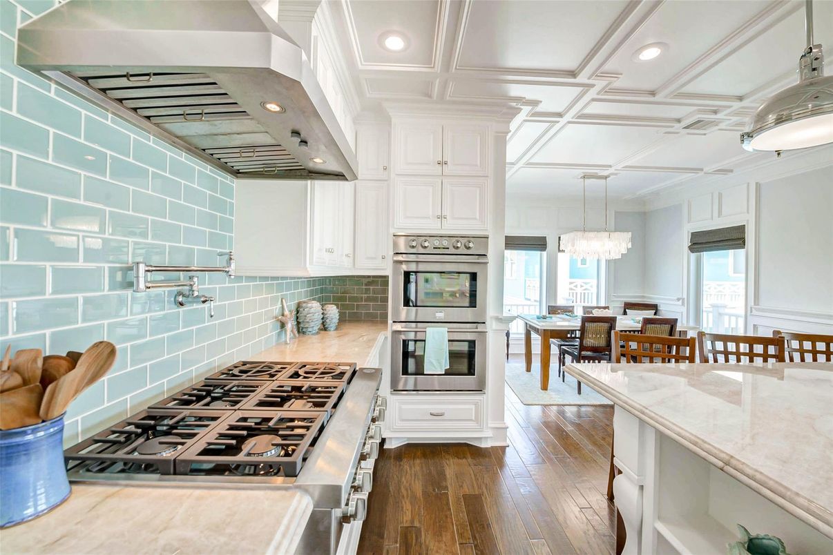 Chandelier, Dining room, Interior, Kitchen, Recessed Lighting, Stainless Steel Appliances, Wood Texture Flooring