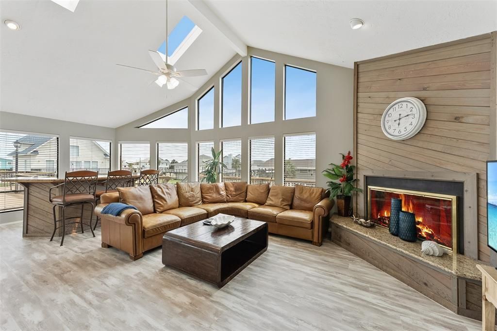 Dining room, Fireplace, Interior, Living room, Recessed Lighting, Wood Texture Flooring, Wooden Walls