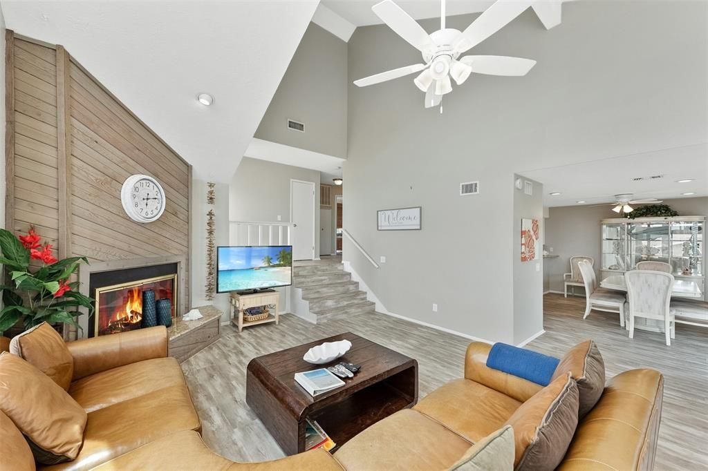Dining room, Fireplace, Interior, Living room, Recessed Lighting, Wood Texture Flooring, Wooden Walls