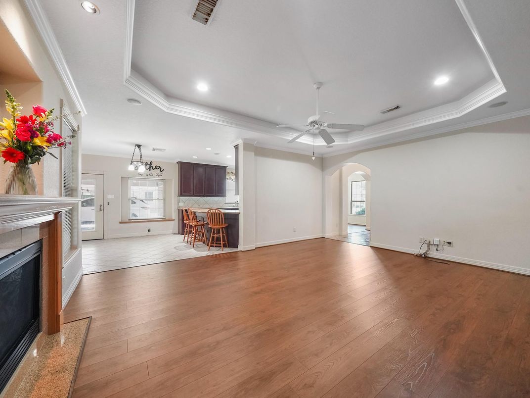 Chandelier, Empty room, Fireplace, Interior, Kitchen, Pendant Lights, Recessed Lighting, Wood Texture Flooring