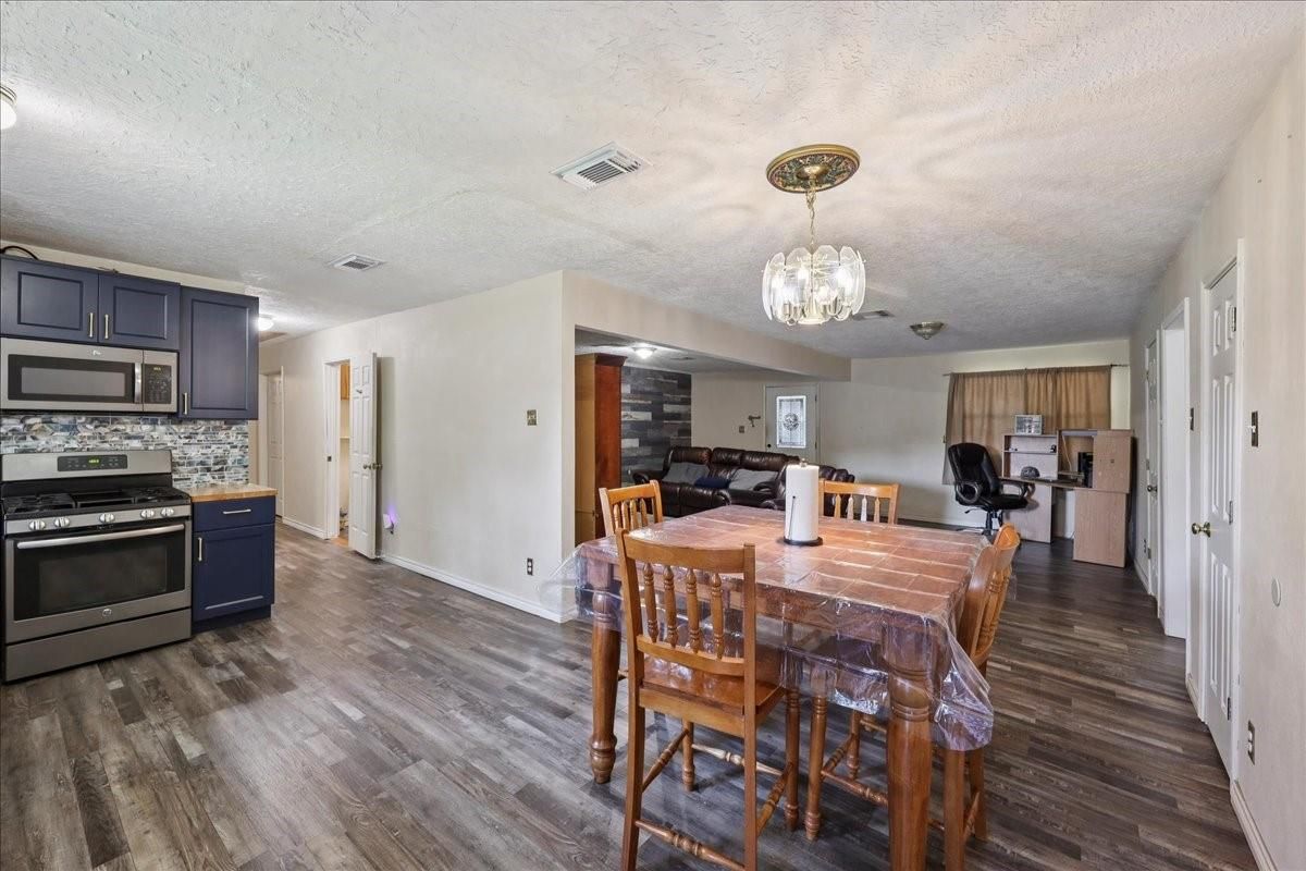 Chandelier, Dining room, Interior, Kitchen, Stainless Steel Appliances, Wood Texture Flooring