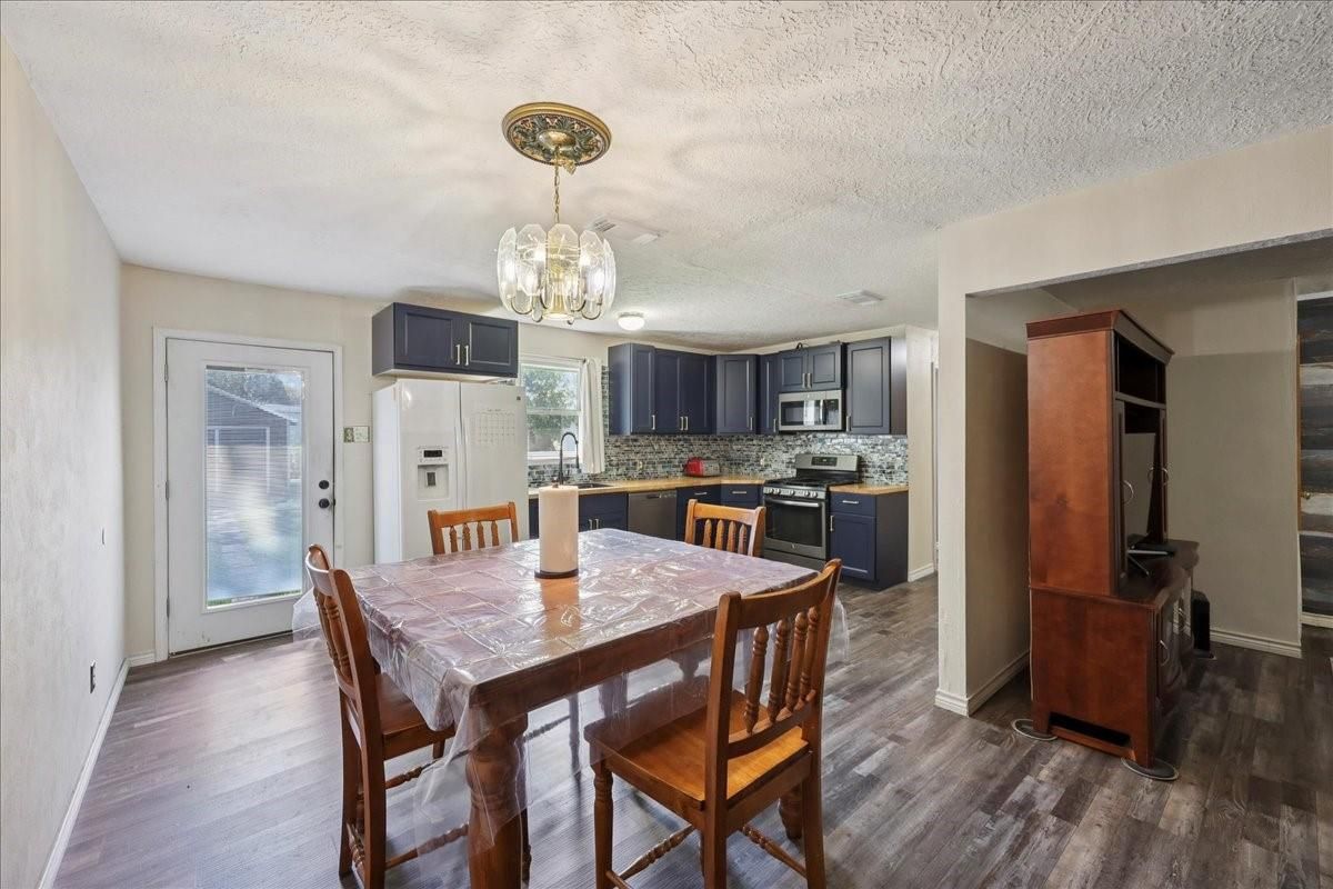 Dining room, Interior, Kitchen, Pendant Lights, Stainless Steel Appliances, Wood Texture Flooring