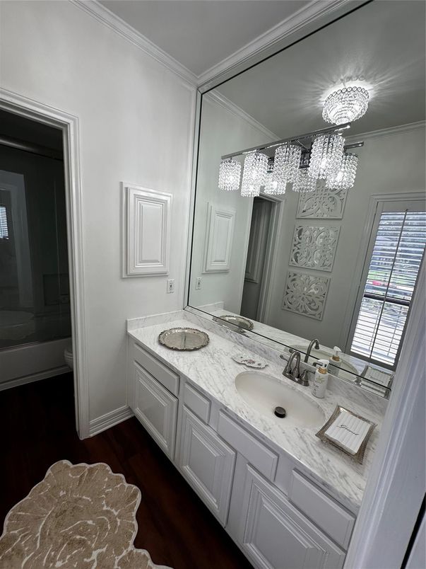 Bathroom, Chandelier, Dual Sink Vanities, Interior, Wood Texture Flooring