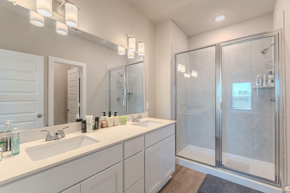Bathroom, Dual Sink Vanities, Glass Shower, Interior, Recessed Lighting, Wood Texture Flooring
