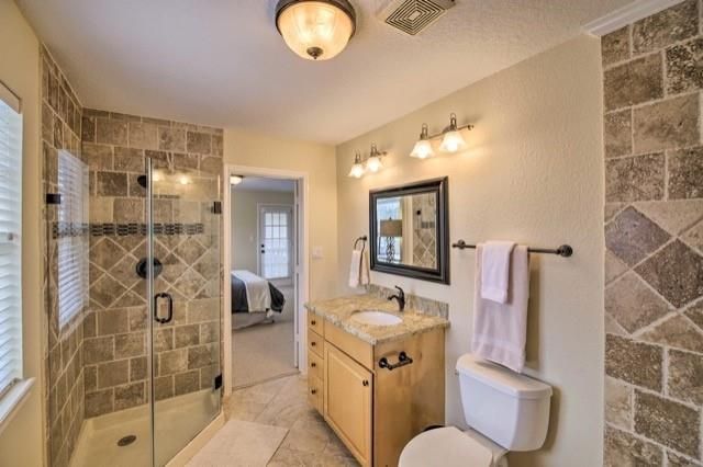 Bathroom, Bedroom, Dual Sink Vanities, Glass Shower, Interior, Stone Walls
