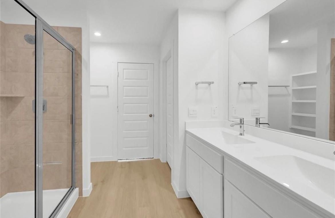 Bathroom, Dual Sink Vanities, Glass Shower, Interior, Recessed Lighting, Wood Texture Flooring
