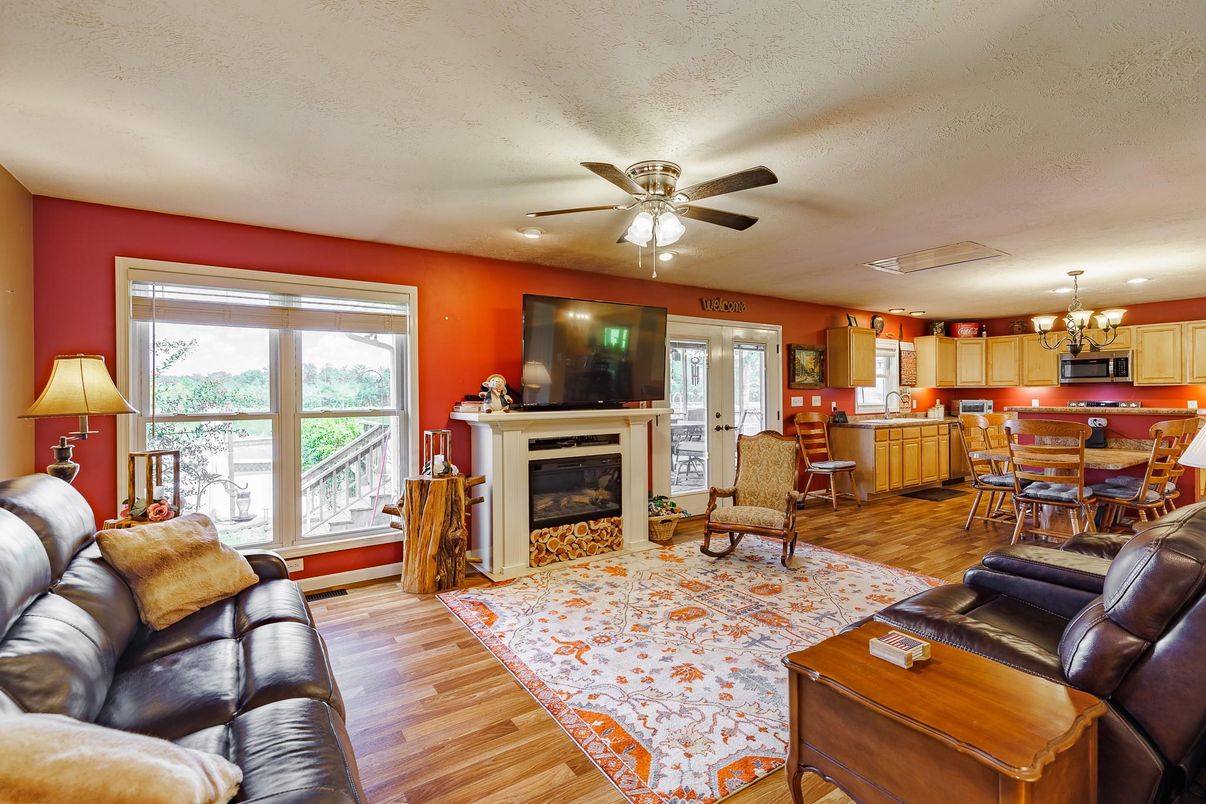Chandelier, Dining room, Fireplace, Interior, Kitchen, Living room, Pendant Lights, Wood Texture Flooring