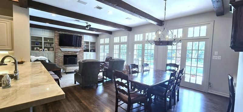 Chandelier, Dining room, Fireplace, Interior, Living room, Recessed Lighting, Stone Walls, Wooden Beams, Wood Texture Flooring
