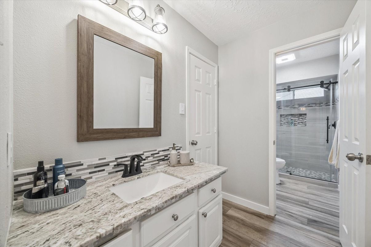 Bathroom, Dual Sink Vanities, Glass Shower, Interior, Wood Texture Flooring