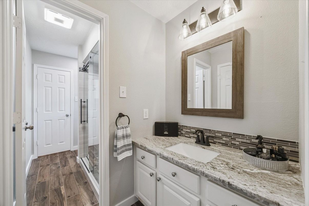 Bathroom, Dual Sink Vanities, Glass Shower, Interior, Wood Texture Flooring