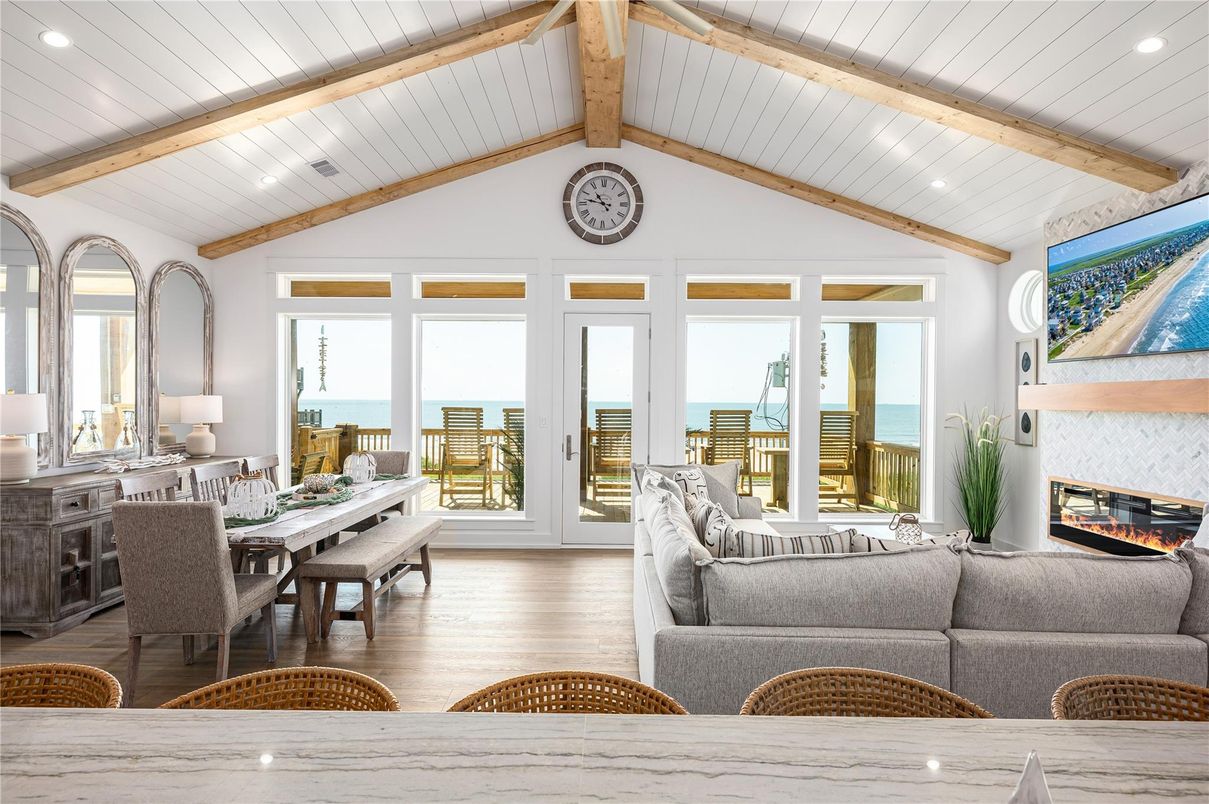 Dining room, Fireplace, Interior, Living room, Recessed Lighting, Water, Wooden Beams, Wood Texture Flooring