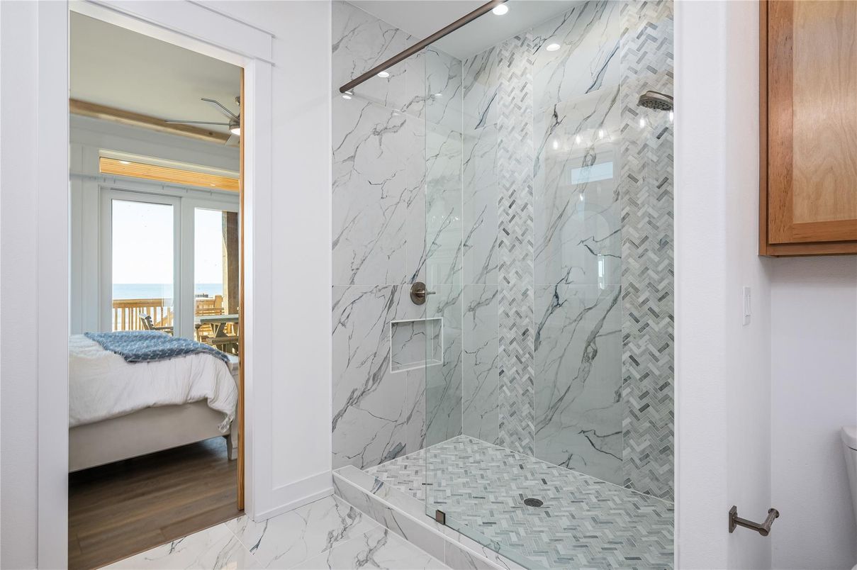 Bathroom, Bedroom, Glass Shower, Interior, Marble, Marble Walls, Recessed Lighting, Water, Wood Texture Flooring