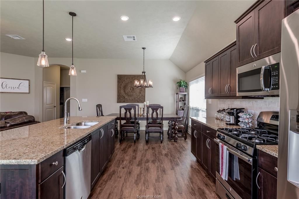 Chandelier, Dining room, Interior, Kitchen, Pendant Lights, Recessed Lighting, Stainless Steel Appliances, Wood Texture Flooring